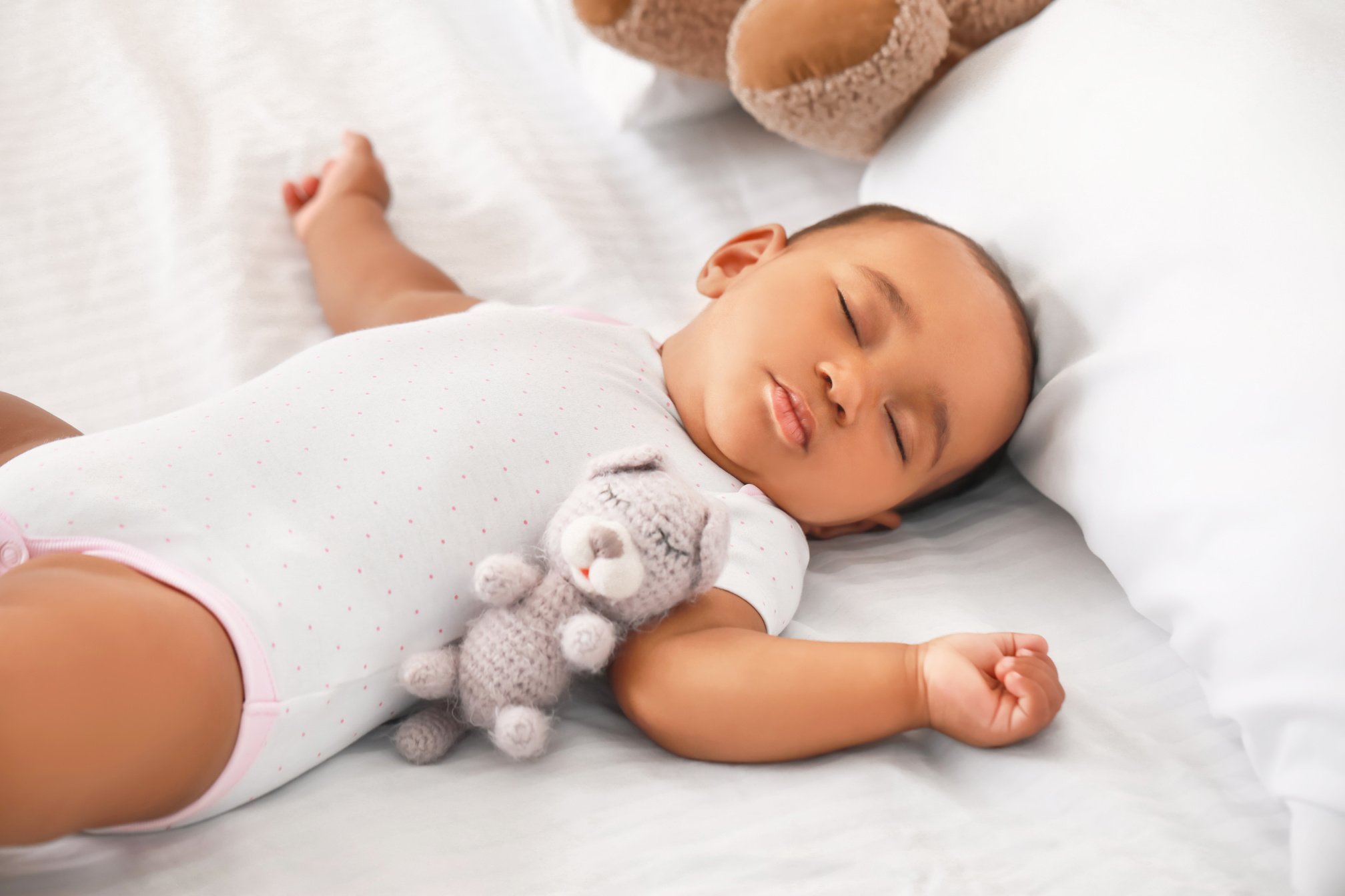 Cute Baby Sleeping on Bed